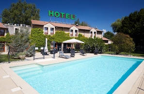 Seasonal outdoor pool, pool umbrellas, pool loungers