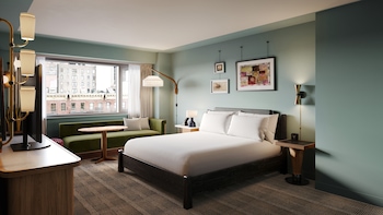 Hypo-allergenic bedding, in-room safe, laptop workspace, blackout drapes at Romer Hells Kitchen