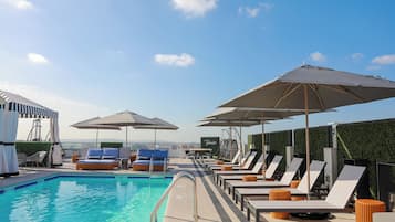 Outdoor pool, pool cabanas (surcharge), pool loungers