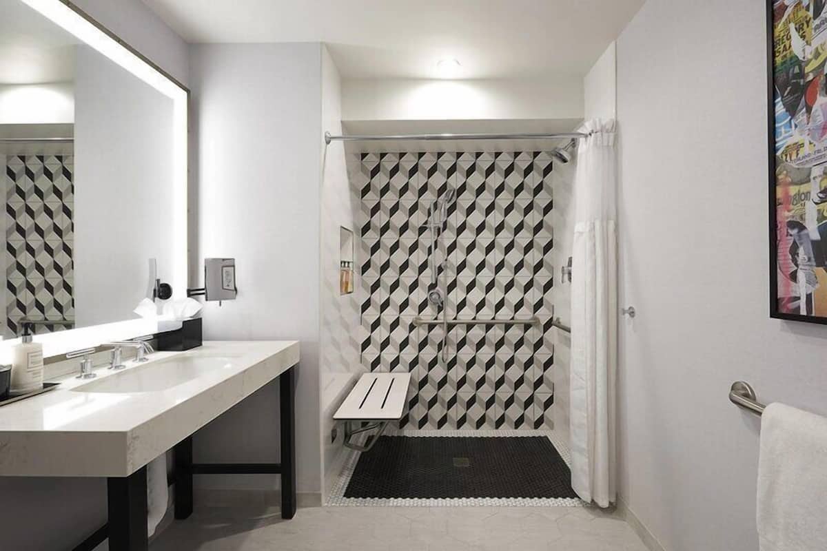 Designer toiletries, hair dryer, bathrobes, towels