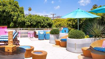 Outdoor pool, open 6 AM to 9 PM, pool loungers