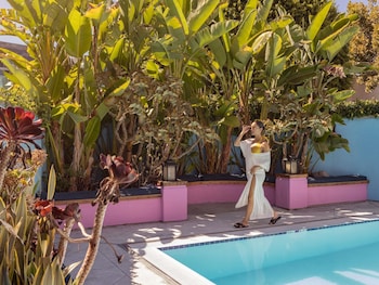 Outdoor pool, open 6 AM to 9 PM, sun loungers at Sofitel LA at Beverly Hills