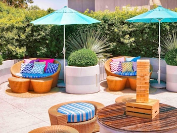 Outdoor pool, open 6 AM to 9 PM, sun loungers at Sofitel LA at Beverly Hills