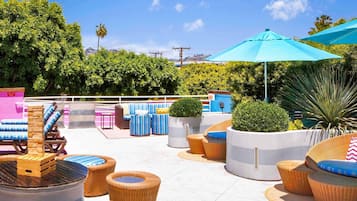 Outdoor pool, open 6 AM to 9 PM, pool loungers