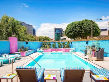 Outdoor pool, open 6 AM to 9 PM, sun loungers at Sofitel LA at Beverly Hills