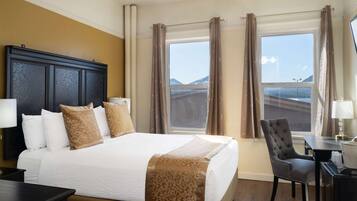 Desk, laptop workspace, blackout drapes, iron/ironing board