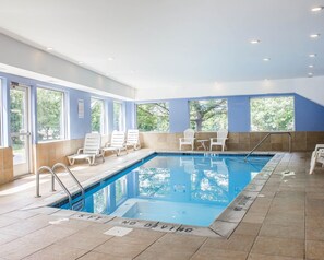 Indoor pool, open 9:00 AM to 10:00 PM, pool loungers