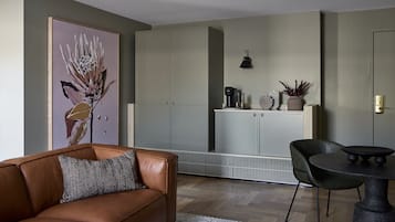 Luxury King Suite | Living area | 43-inch flat-screen TV with cable channels, TV