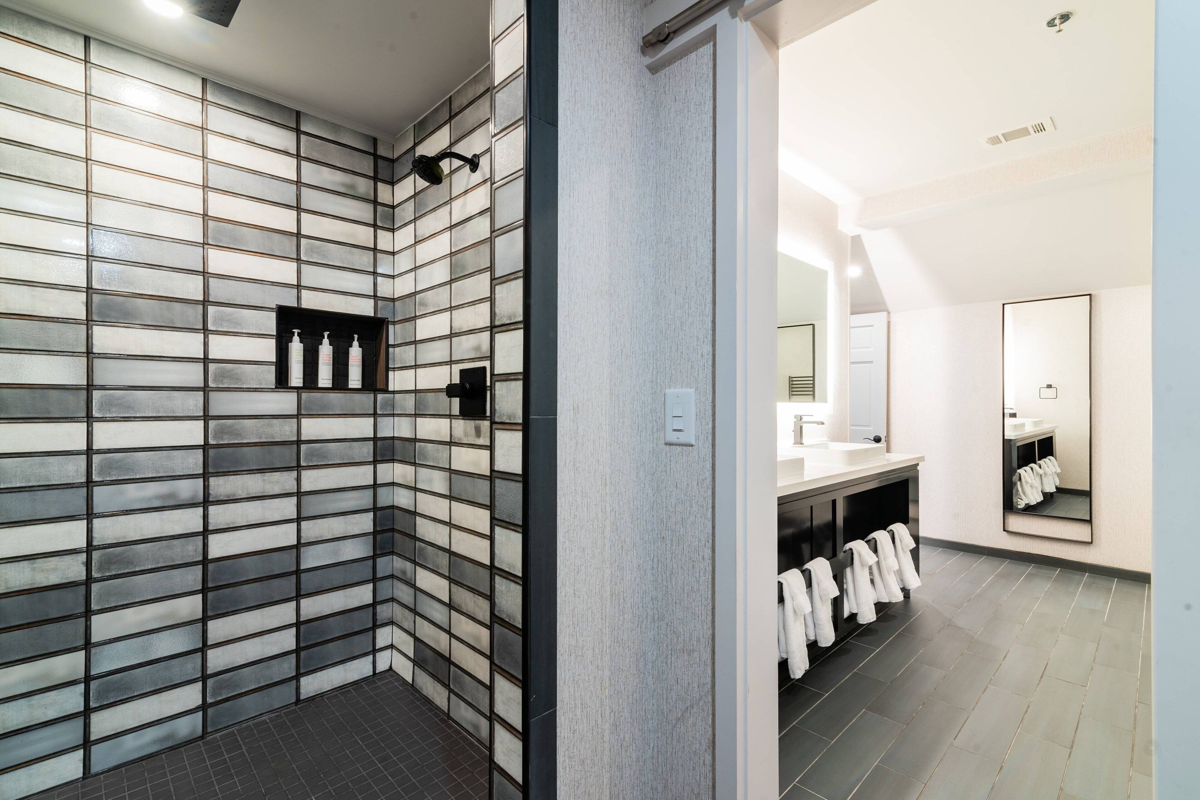 designer toiletries, hair dryer, towels, soap