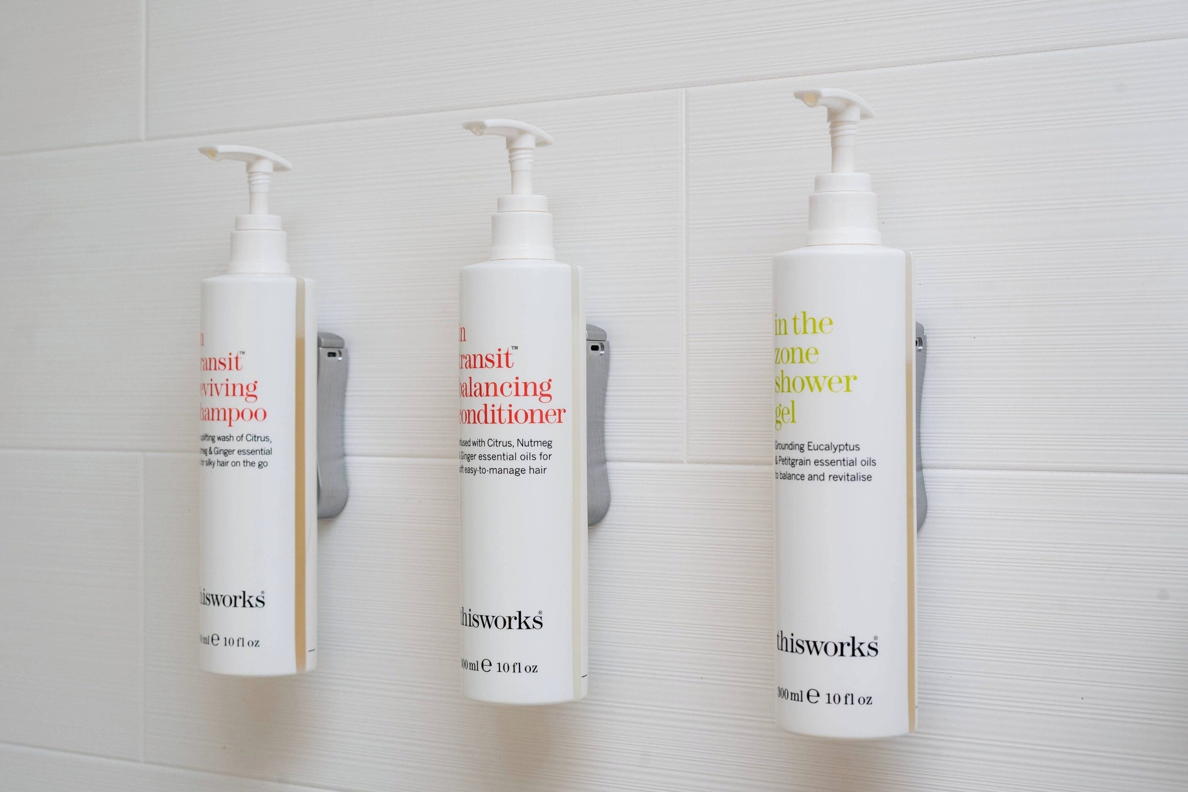 designer toiletries, hair dryer, towels, soap