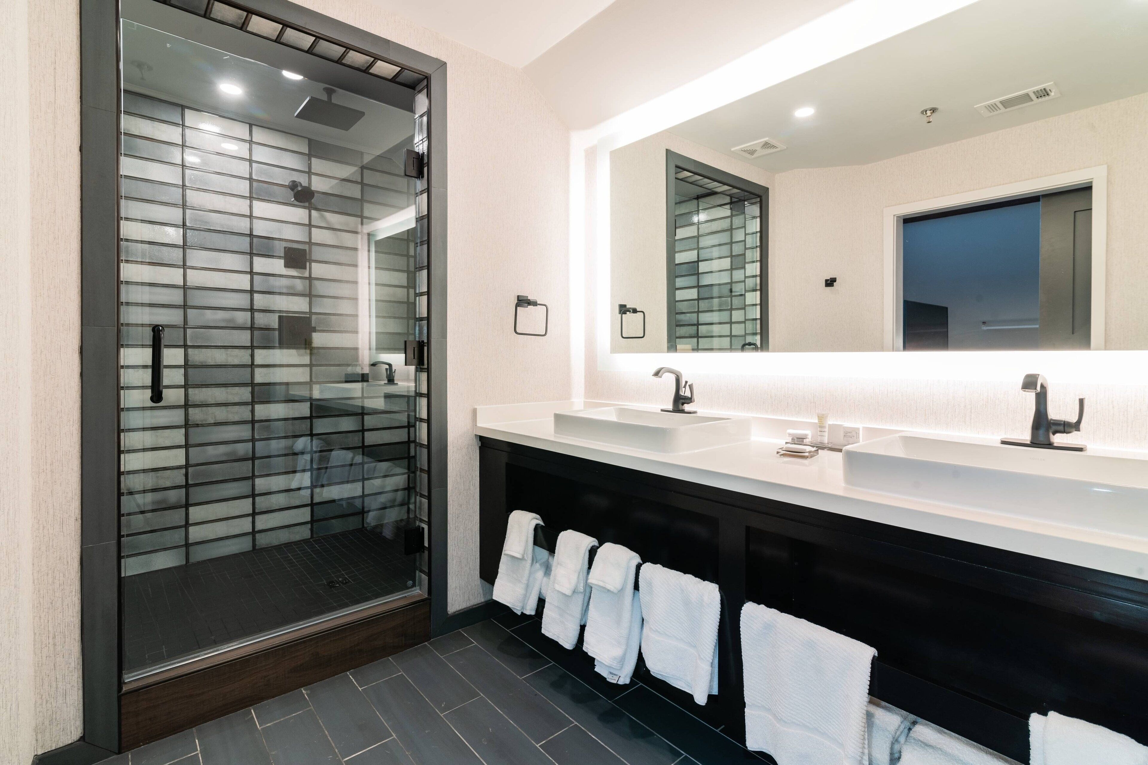 designer toiletries, hair dryer, towels, soap