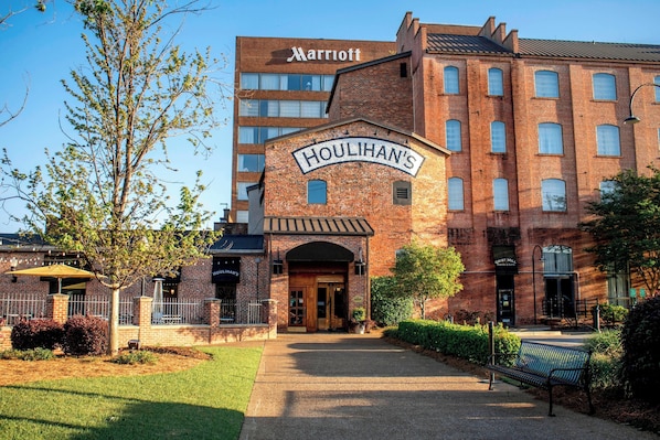 A brick building with a sign reading "Houlihan's" and "Marriott" above it.