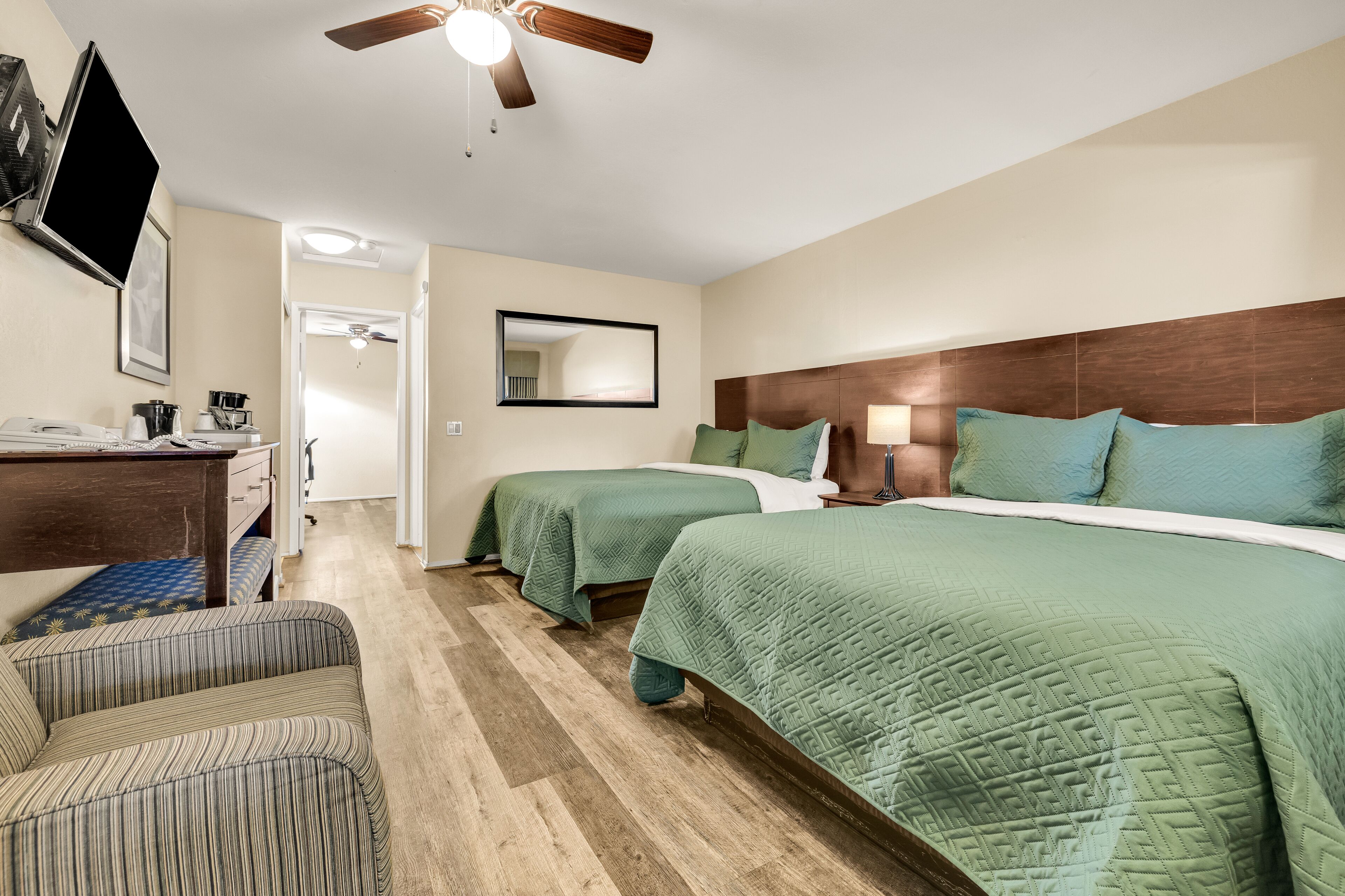 deluxe room, 3 queen beds | desk, laptop workspace, iron/ironing board, free wifi