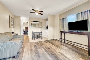 Suite, 1 King Bed with Sofa bed, Patio | 1 bedroom, desk, laptop workspace, iron/ironing board