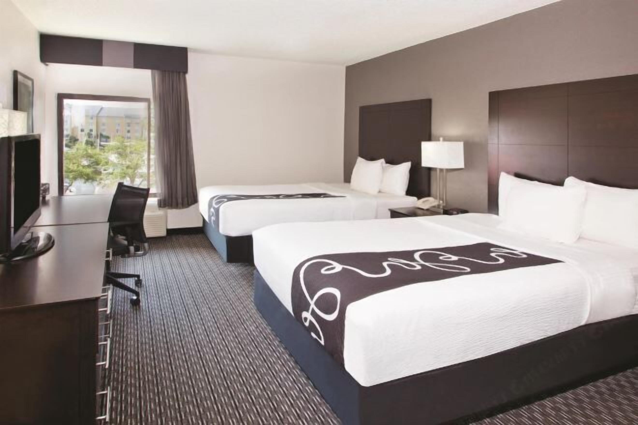 Premium bedding, pillow-top beds, desk, blackout curtains