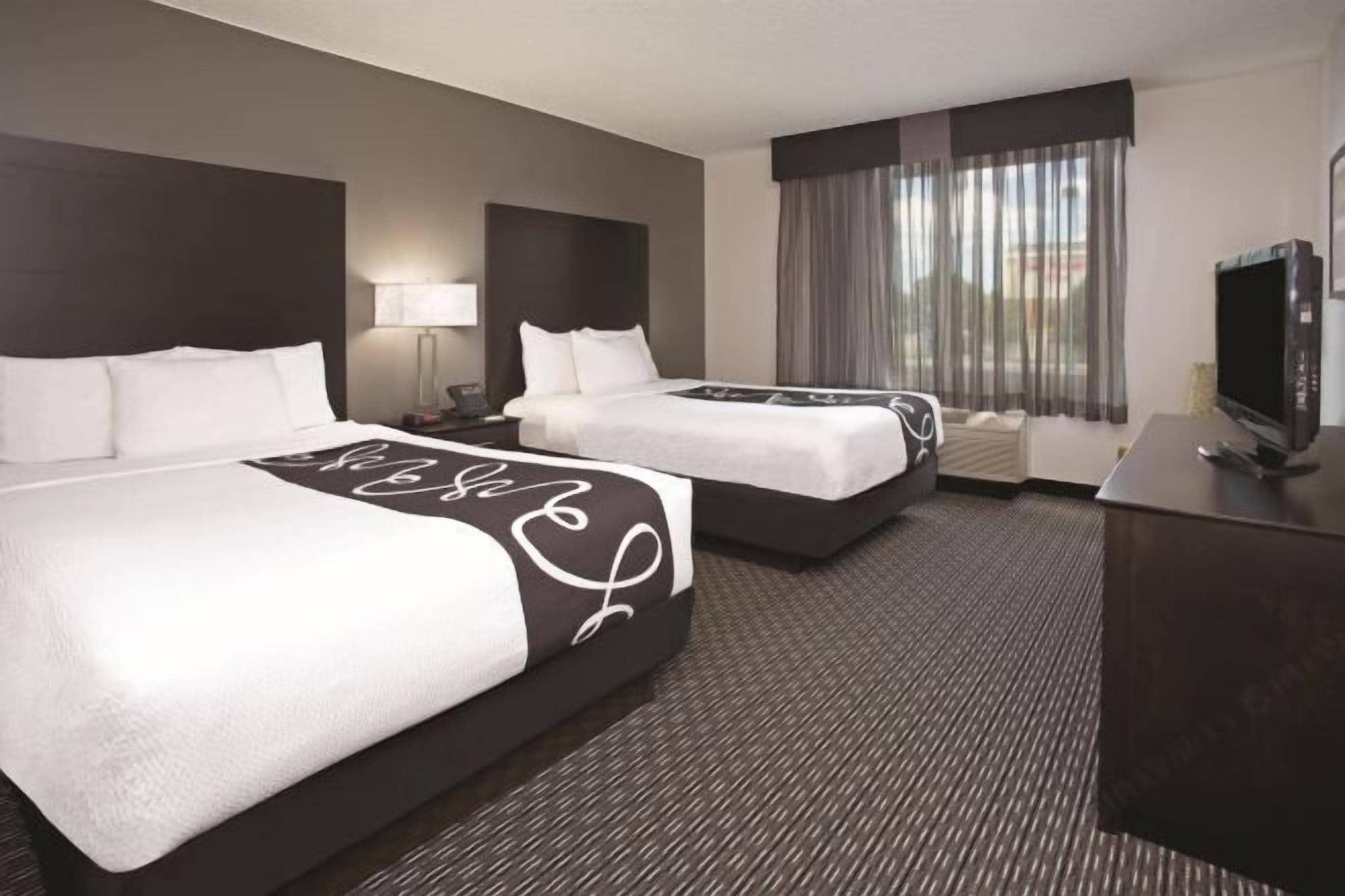 Premium bedding, pillow-top beds, desk, blackout curtains