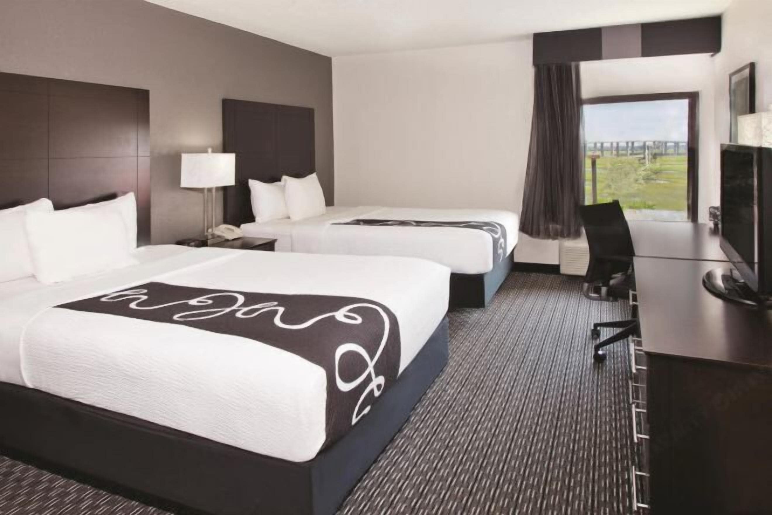 Premium bedding, pillow-top beds, desk, blackout curtains