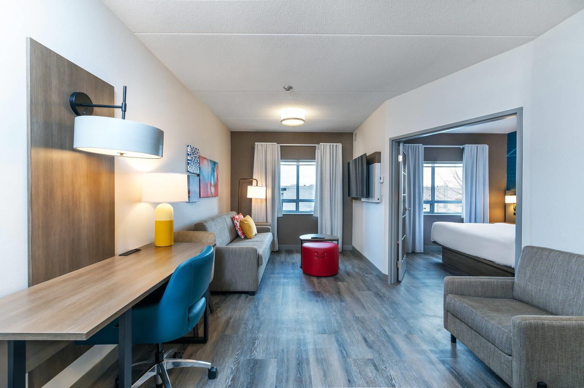 1 King Bed, 1 Bedroom Suite | Living area | 55-inch flat-screen TV with cable channels, TV