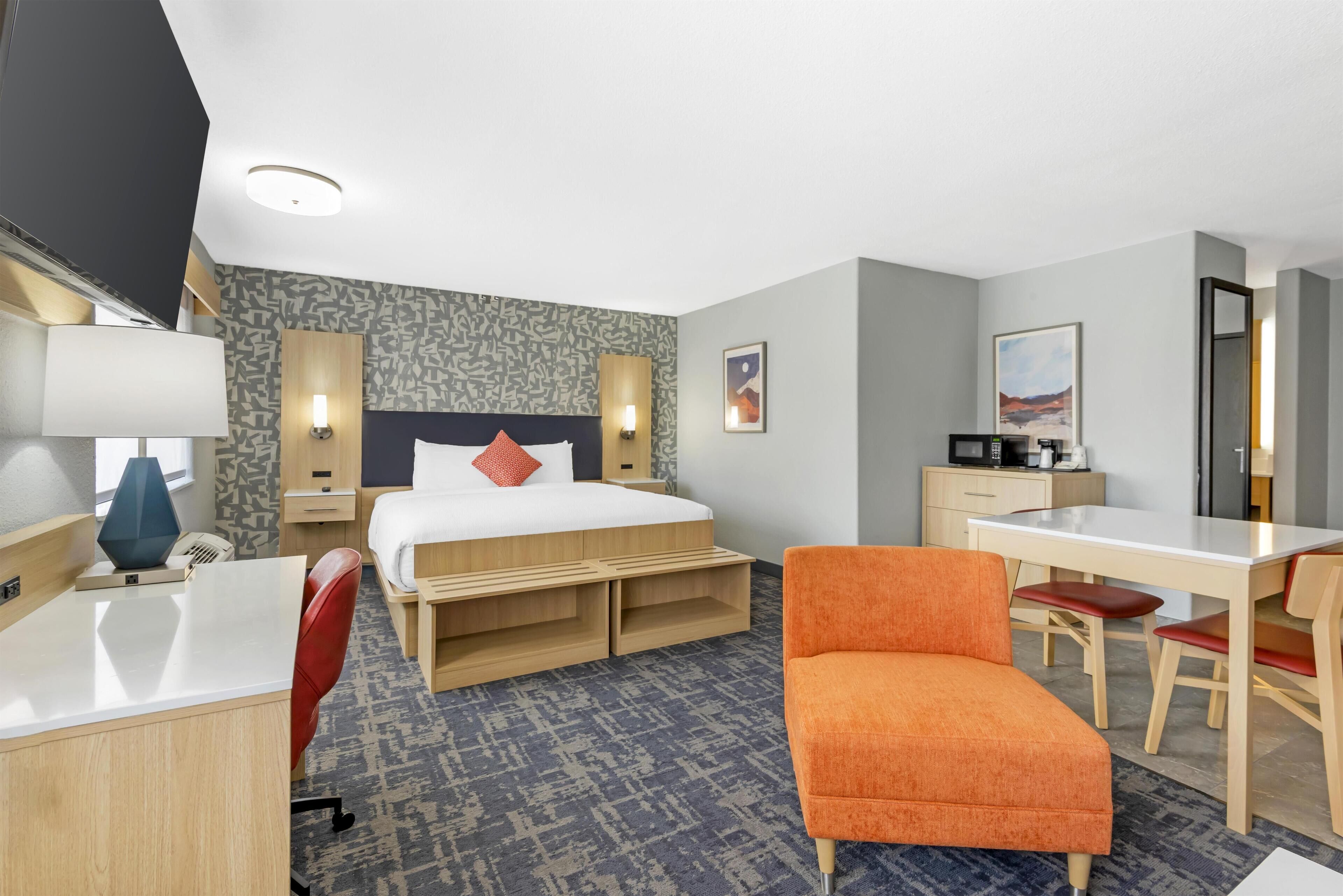 Suite, 1 King Bed, Non Smoking (Dining Table;Walk-in Shower) | Pillowtop beds, desk, laptop workspace, blackout drapes