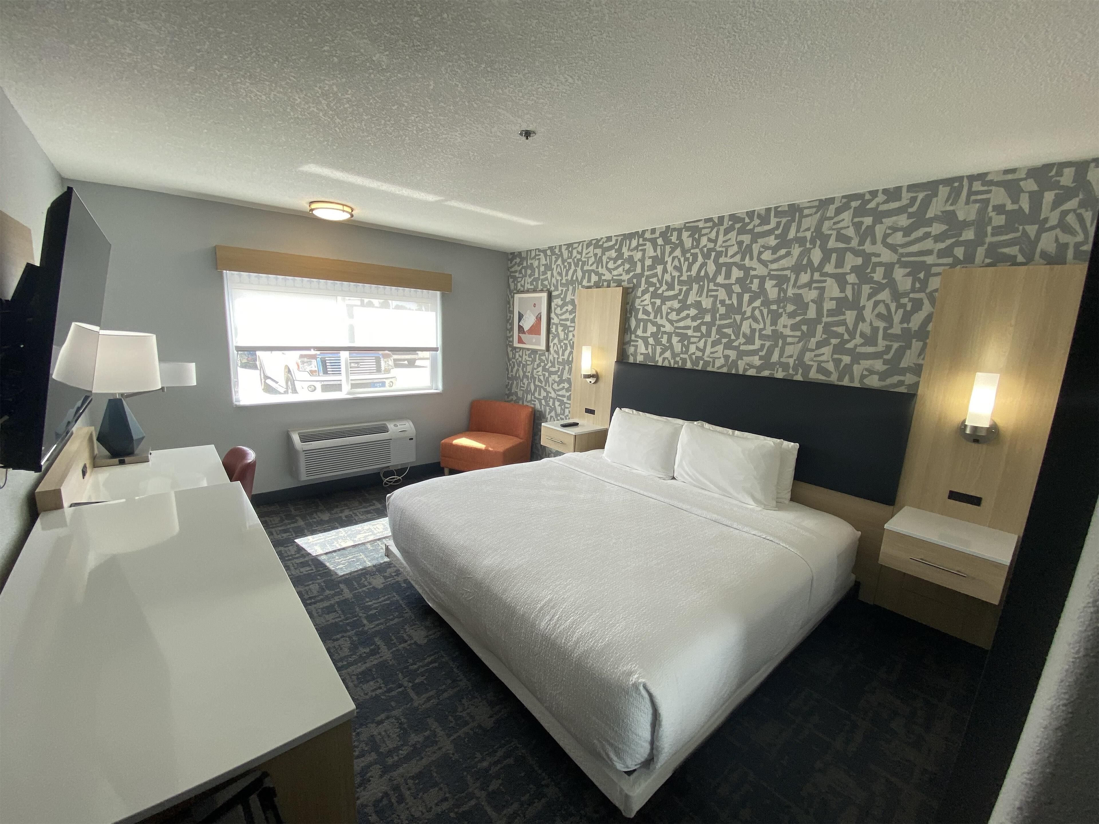 pillow-top beds, desk, laptop workspace, blackout curtains