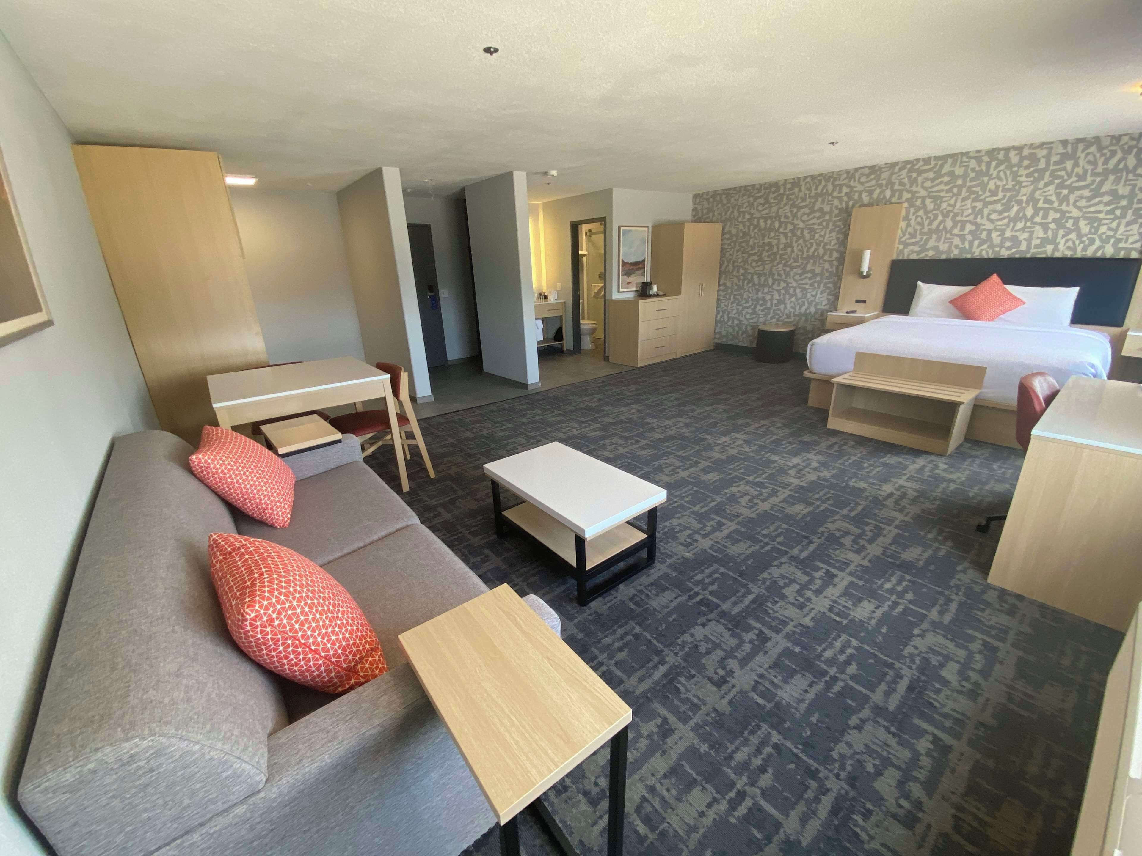 Suite, 1 King Bed, Non Smoking (Dining Table;Walk-in Shower) | Pillowtop beds, desk, laptop workspace, blackout drapes