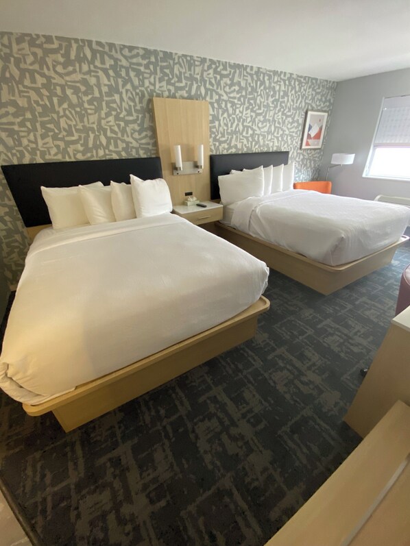 Pillowtop beds, desk, blackout drapes, iron/ironing board