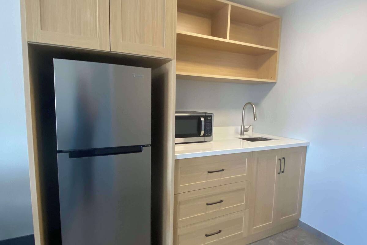 suite, 1 king bed, non smoking, kitchenette (dining table;walk-in shower) | private kitchenette | fridge, microwave, coffee/tea maker