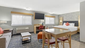 Suite, 1 King Bed, Non Smoking (Dining Table;Walk-in Shower) | Pillowtop beds, desk, laptop workspace, blackout drapes