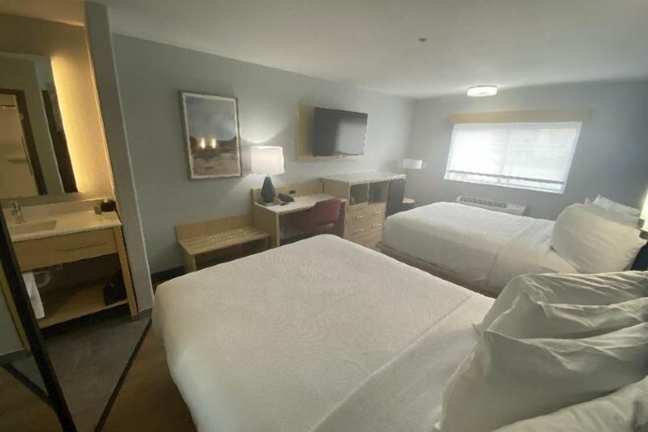 Pillowtop beds, desk, laptop workspace, blackout drapes