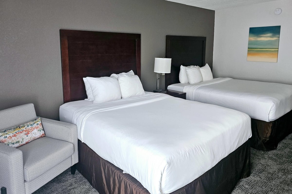 Premium bedding, desk, laptop workspace, blackout curtains