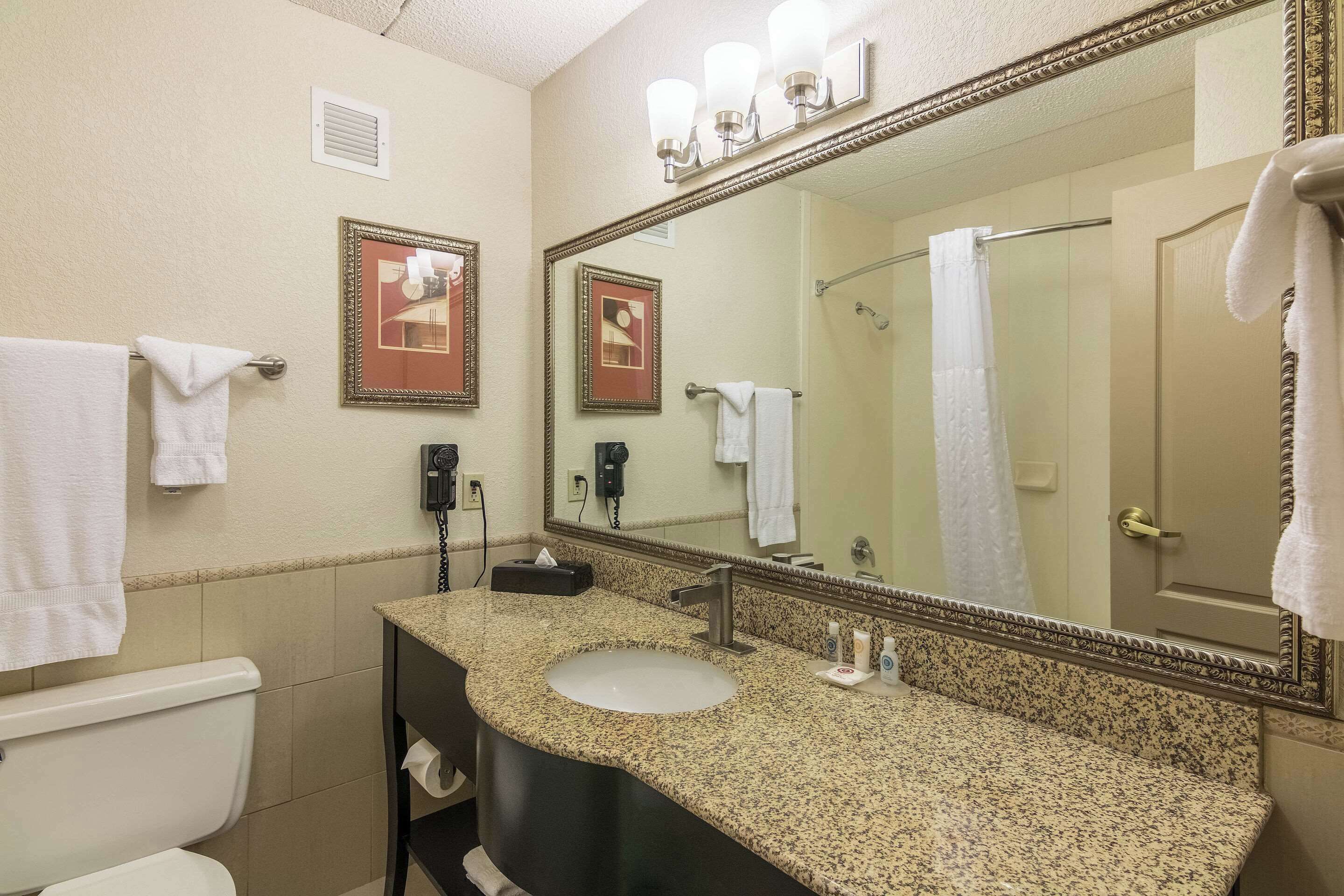 premium bedding, desk, laptop workspace, blackout curtains