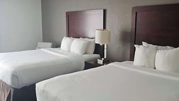 Premium bedding, desk, laptop workspace, blackout curtains