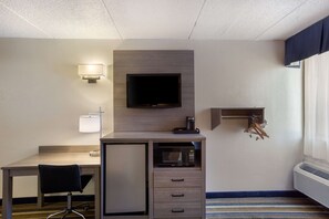 Hypo-allergenic bedding, desk, laptop workspace, blackout drapes