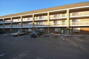 A multi-story parking garage with several cars parked. - HomeTowne Studios by Red Roof Denver - Lakewood West (Lakewood)