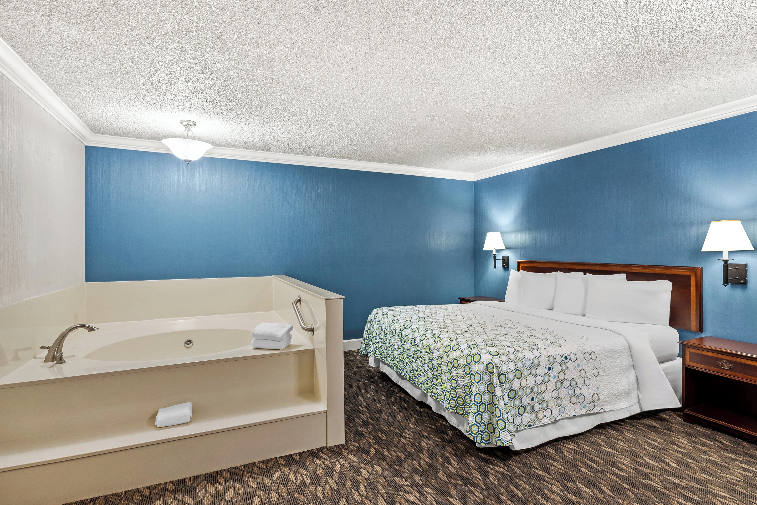 Suite, 1 King Bed, Non Smoking, Jetted Tub | Desk, laptop workspace, blackout drapes, iron/ironing board