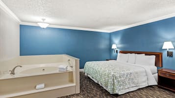 Suite, 1 King Bed, Non Smoking, Jetted Tub | Desk, laptop workspace, blackout drapes, iron/ironing board