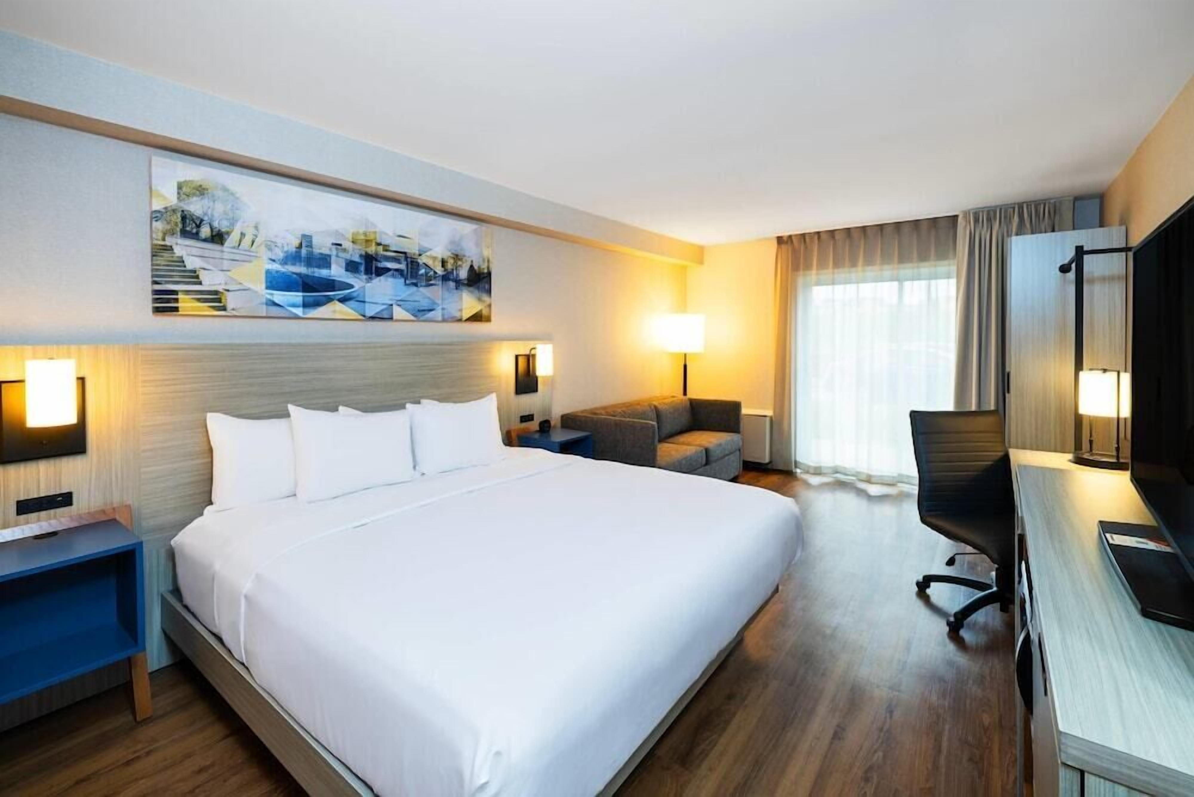 Premium bedding, desk, blackout curtains, iron/ironing board