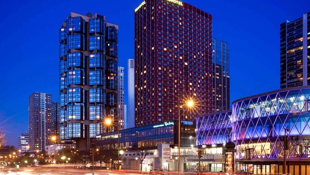 A modern hotel with a distinctive facade, multiple floors, and a prominent 'Novotel' sign. - Novotel Paris Centre Tour Eiffel (Paris)