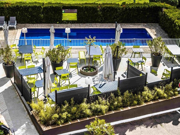 Seasonal outdoor pool, open 10:00 AM to 8:00 PM, pool loungers