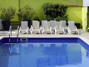 Seasonal outdoor pool, open 10:00 AM to 8:00 PM, pool loungers