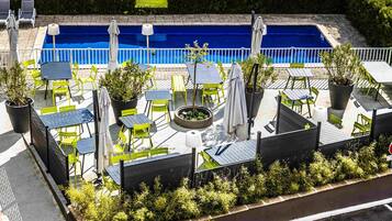 Seasonal outdoor pool, open 10:00 AM to 8:00 PM, pool loungers