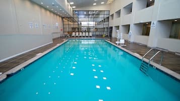 Indoor pool, open 9 AM to 11:00 PM, pool loungers