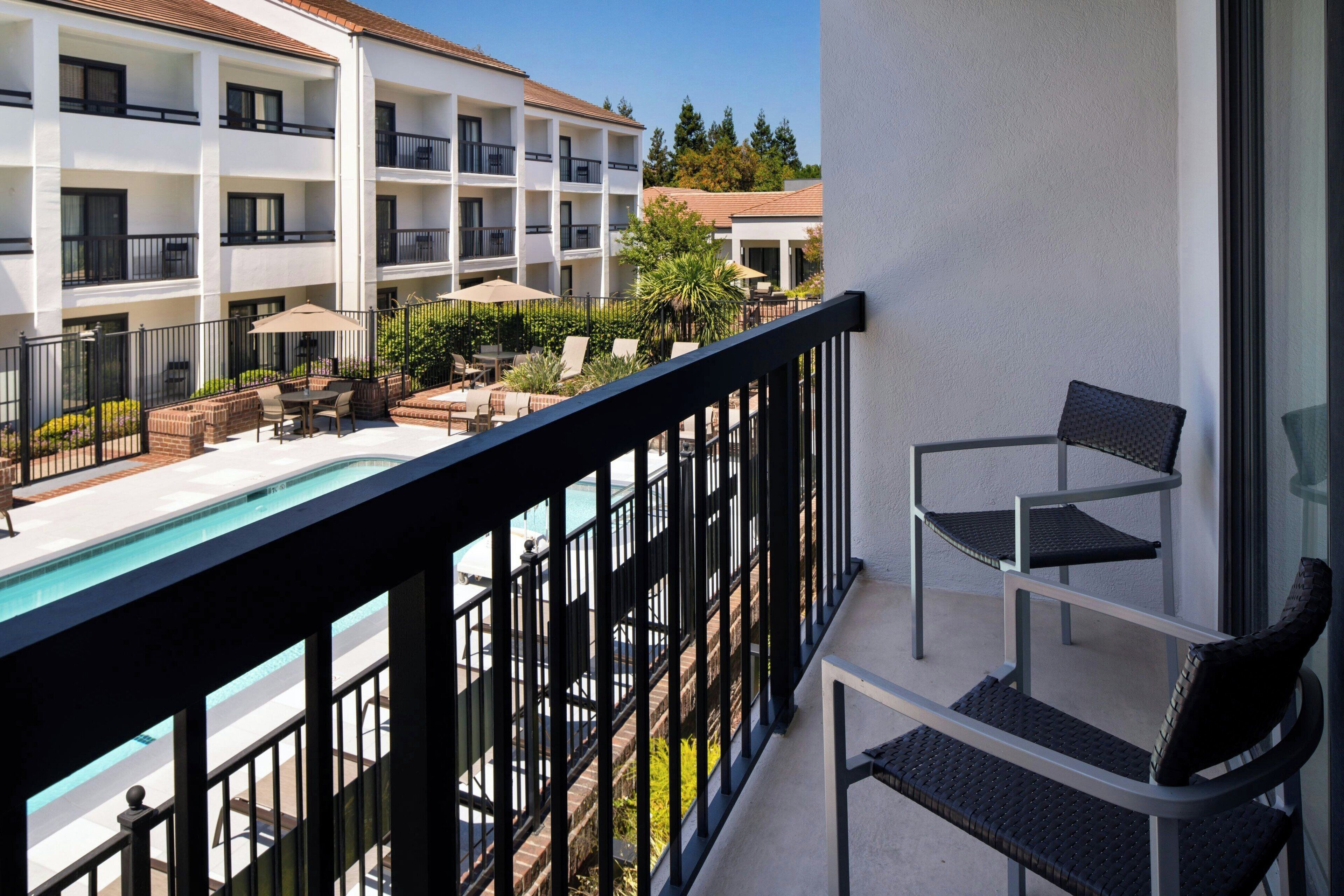 room, 1 king bed with sofa bed, garden view | pool | seasonal outdoor pool