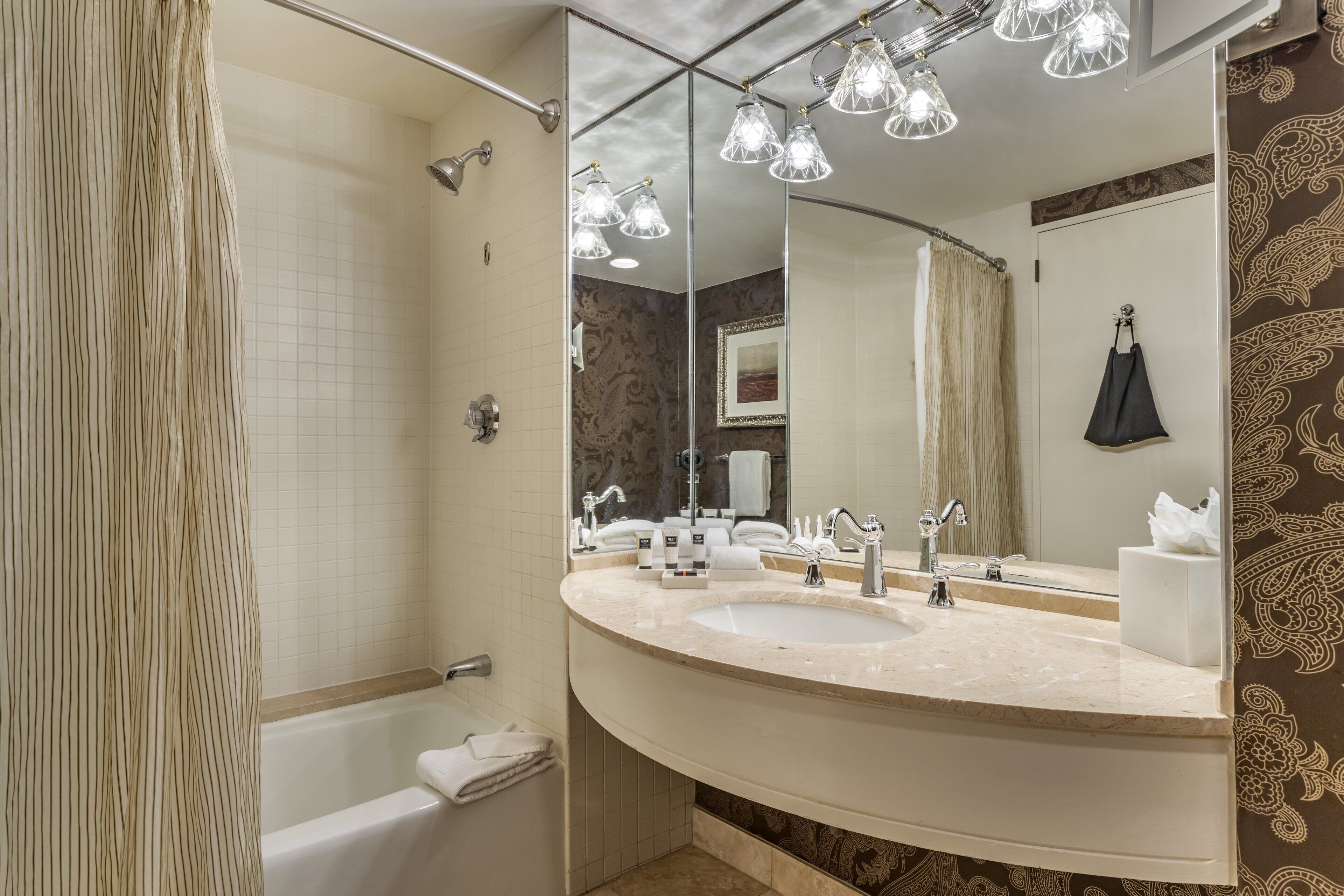 Designer toiletries, hair dryer, bathrobes, slippers