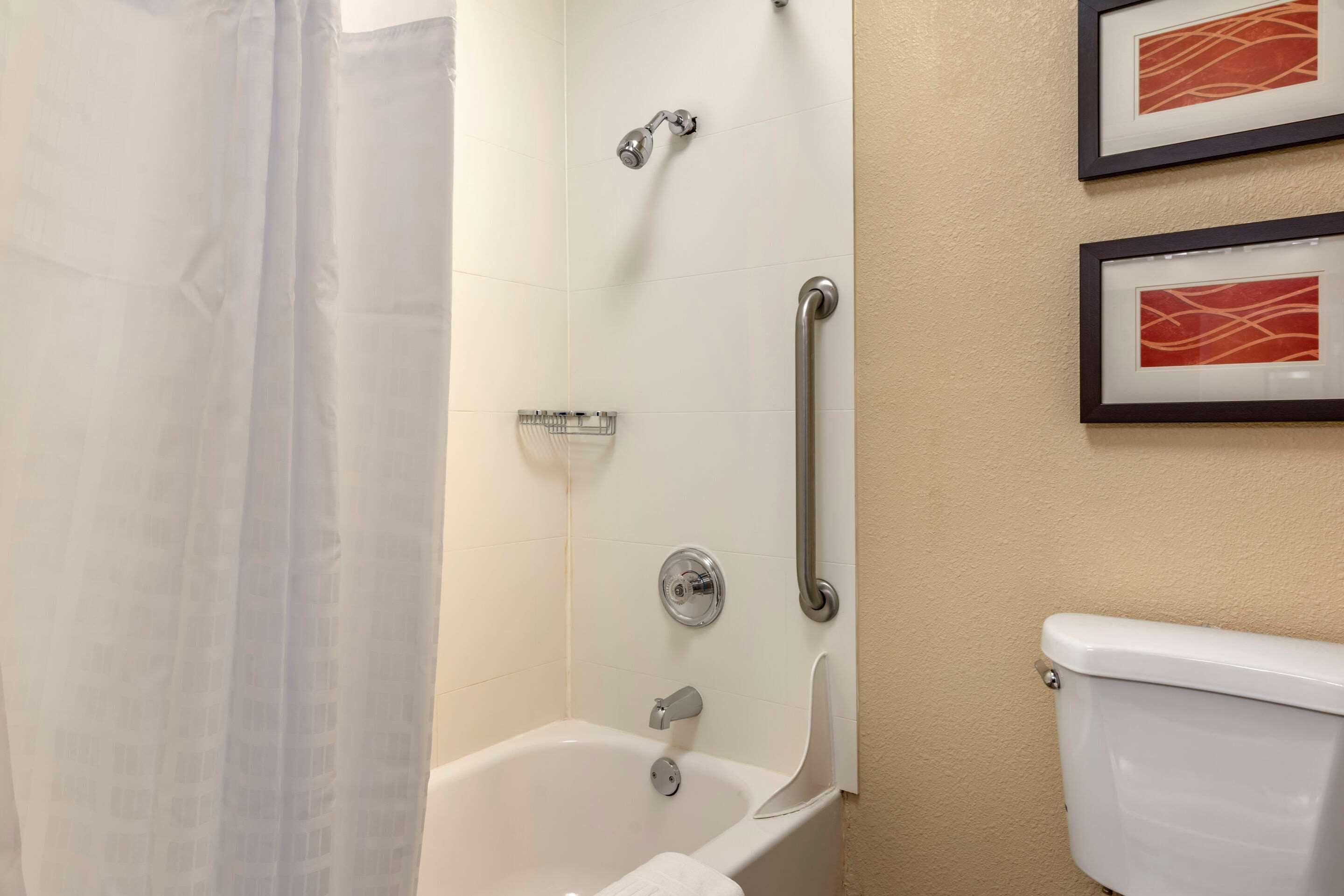 room, 1 king bed, non smoking (upgrade) | bathroom | combined shower/bathtub, free toiletries, hair dryer, towels