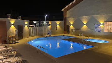 Outdoor pool, open 9:00 AM to 10:00 PM, pool loungers