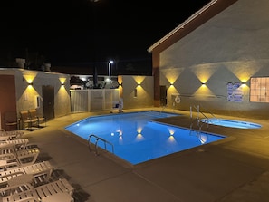 Outdoor pool, open 9:00 AM to 10:00 PM, pool loungers