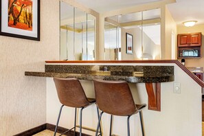 Suite, 1 King Bed, Non Smoking, Jetted Tub | Laptop workspace, iron/ironing board, rollaway beds, free WiFi