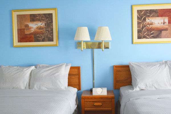Standard Room, 2 Queen Beds | Individually furnished, desk, laptop workspace, blackout drapes