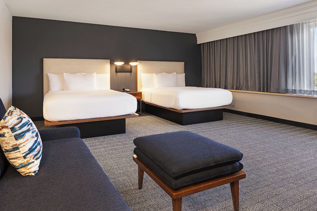 junior suite, multiple beds, non smoking | in-room safe, desk, laptop workspace, iron/ironing board